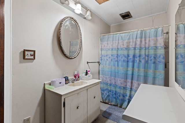 bathroom featuring ornamental molding, vanity, and a shower with shower curtain