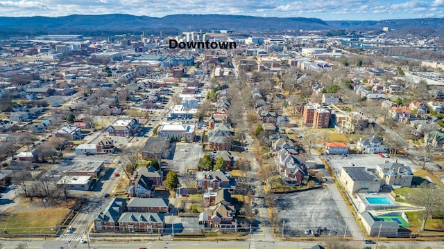 birds eye view of property featuring a mountain view