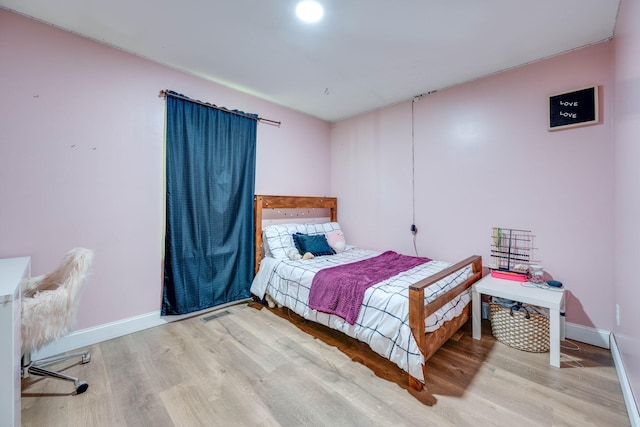 bedroom featuring light wood-type flooring