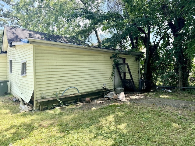 view of home's exterior featuring a lawn