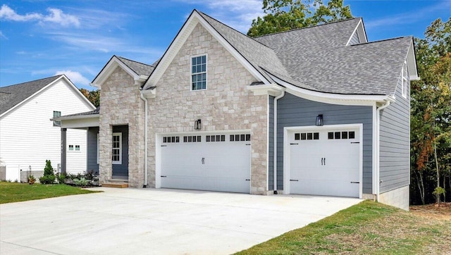 view of front facade featuring a garage and a front lawn