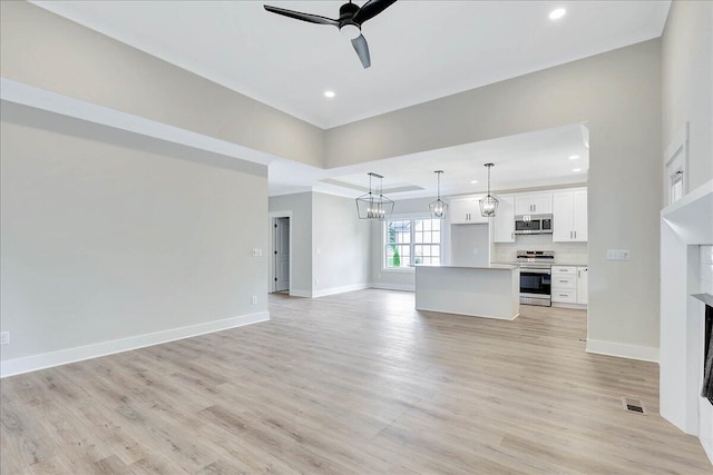 unfurnished living room with ceiling fan and light hardwood / wood-style floors