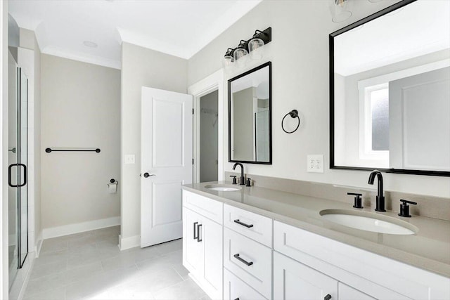 bathroom with ornamental molding, vanity, a shower with shower door, and tile patterned flooring