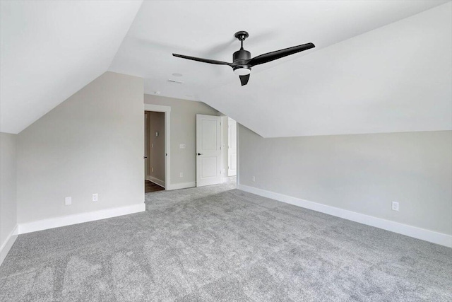 bonus room with vaulted ceiling, ceiling fan, and carpet floors