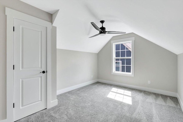 bonus room with carpet, ceiling fan, and vaulted ceiling