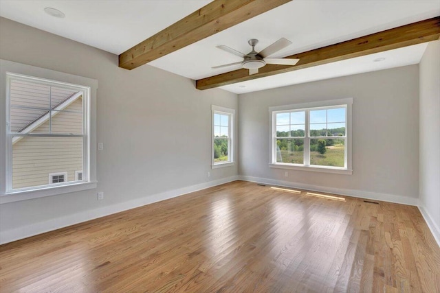 unfurnished room with ceiling fan, beam ceiling, and light hardwood / wood-style flooring