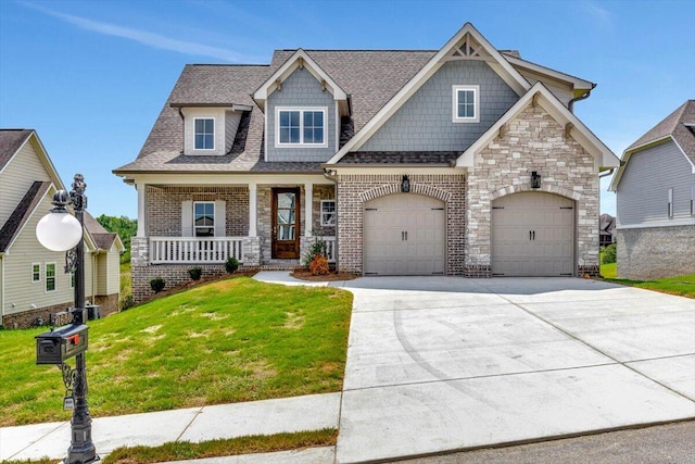 craftsman-style home with a porch and a front yard