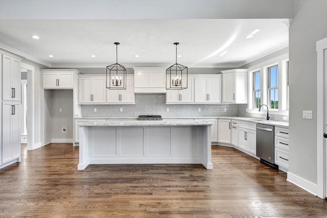 kitchen featuring appliances with stainless steel finishes, a center island, and dark wood-type flooring