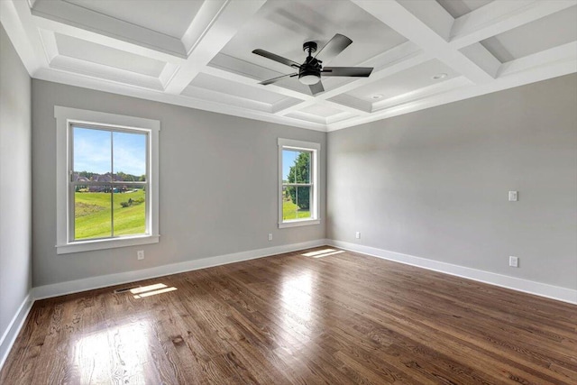 spare room with plenty of natural light, ceiling fan, dark hardwood / wood-style floors, and coffered ceiling