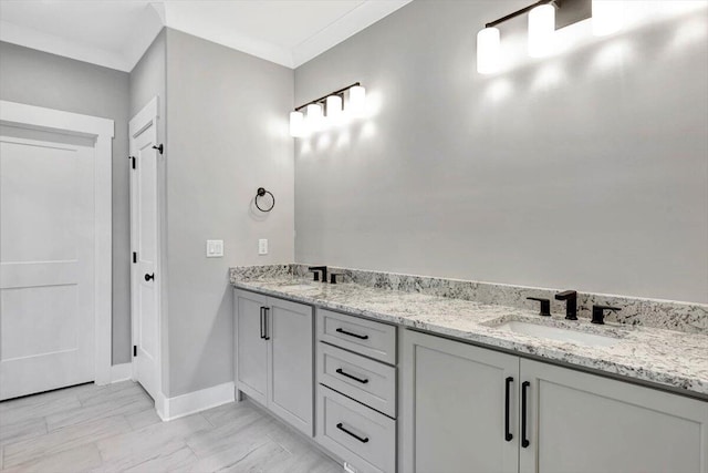 bathroom featuring vanity and ornamental molding