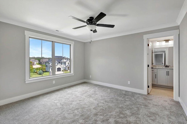 unfurnished room featuring light carpet, crown molding, and ceiling fan