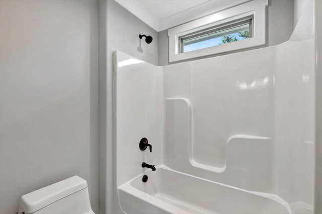 bathroom with shower / tub combination and toilet