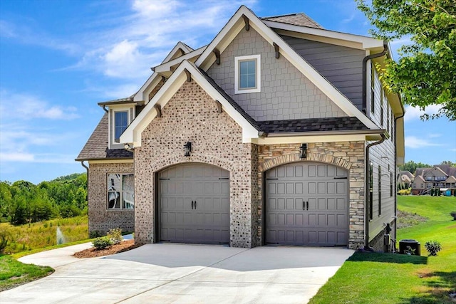 craftsman-style home with a garage and a front yard