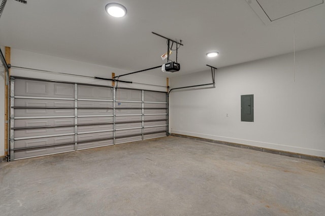 garage with a garage door opener and electric panel