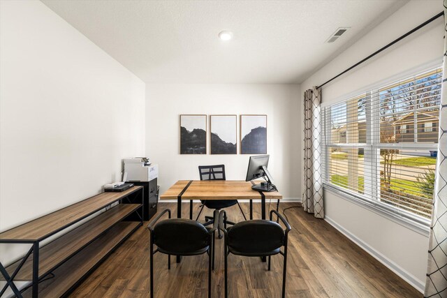 dining room with dark hardwood / wood-style floors