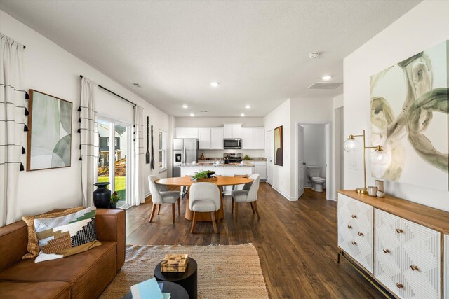 dining space featuring dark hardwood / wood-style flooring