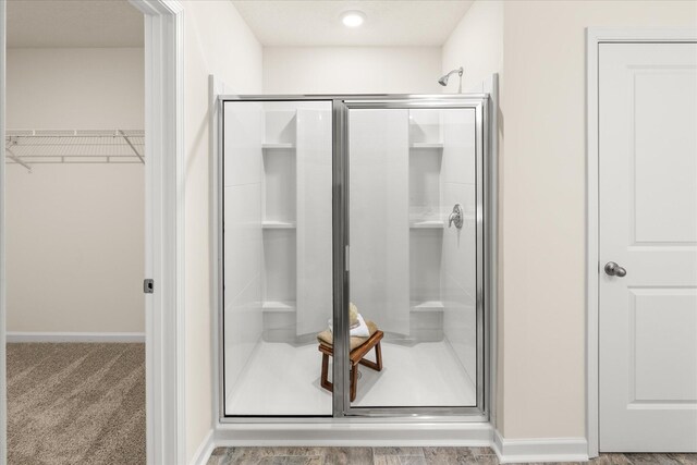 bathroom featuring an enclosed shower