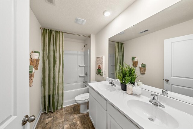 full bathroom with shower / bath combo with shower curtain, toilet, a textured ceiling, and vanity