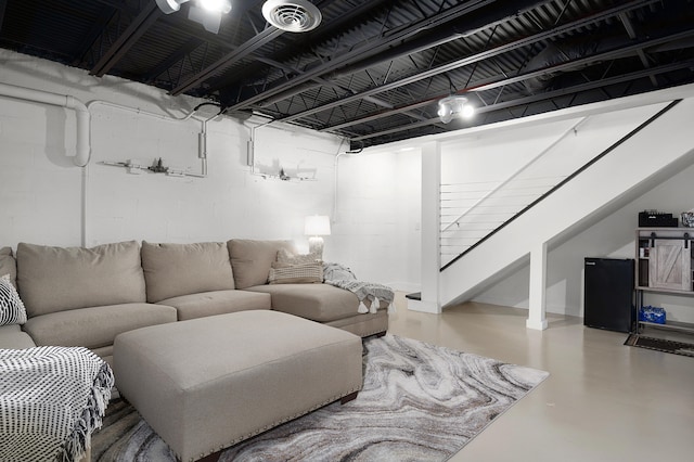 living room with concrete flooring