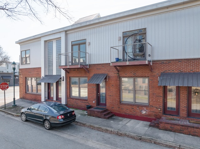 view of front of home with a balcony