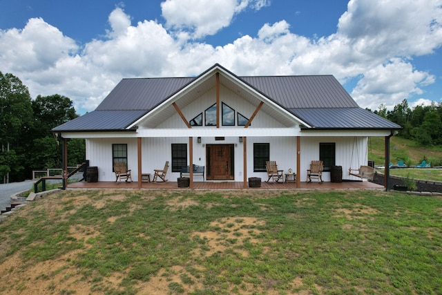 1033 SE Carter Rd, Old Fort, TN 37362 - view of front of property with metal roof, a front lawn, and a porch