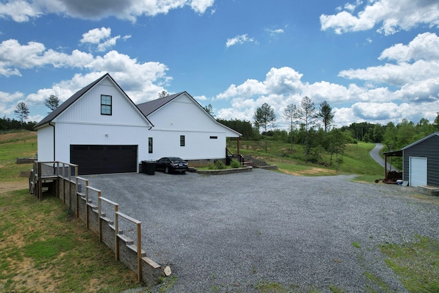 1033 SE Carter Rd, Old Fort, TN 37362 - view of property exterior with driveway and an attached garage