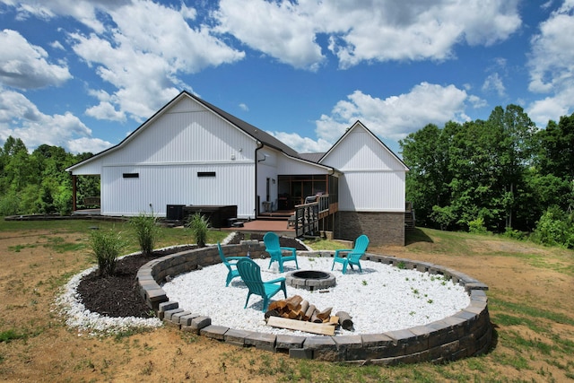 1033 SE Carter Rd, Old Fort, TN 37362 - back of house featuring a fire pit and a yard
