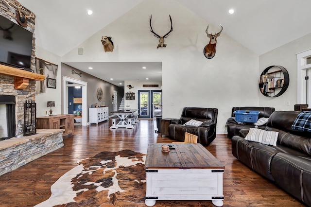 1033 SE Carter Rd, Old Fort, TN 37362 - living room featuring french doors, high vaulted ceiling, a fireplace, and wood finished floors