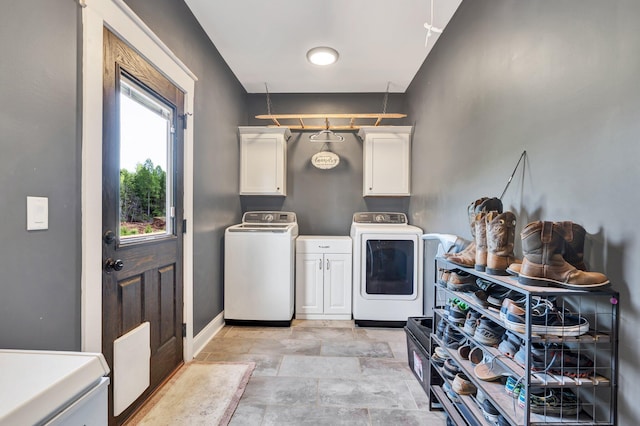 1033 SE Carter Rd, Old Fort, TN 37362 - clothes washing area featuring baseboards, cabinet space, and independent washer and dryer