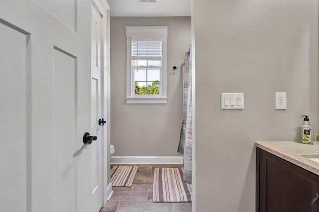1033 SE Carter Rd, Old Fort, TN 37362 - full bath featuring baseboards, visible vents, toilet, and vanity
