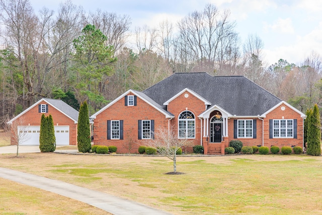 view of front of house featuring a garage and a front lawn