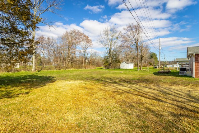 2237 Cloud Springs Rd, Rossville, GA 30741 - view of yard with a storage unit and an outdoor structure