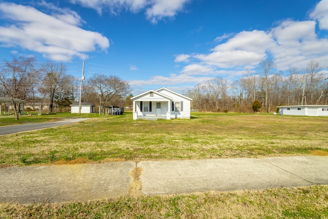 view of home's exterior with an outbuilding, a yard, and a garage