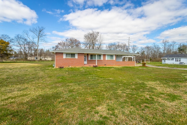 ranch-style home featuring a front lawn