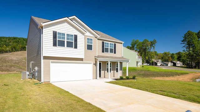 view of front of house featuring a garage and a front yard