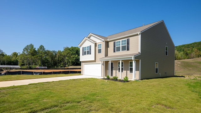 view of front of house with a front lawn and a garage