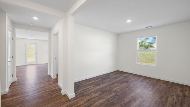 spare room featuring dark hardwood / wood-style floors