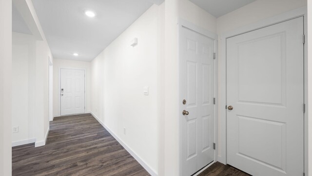 hallway featuring dark hardwood / wood-style flooring