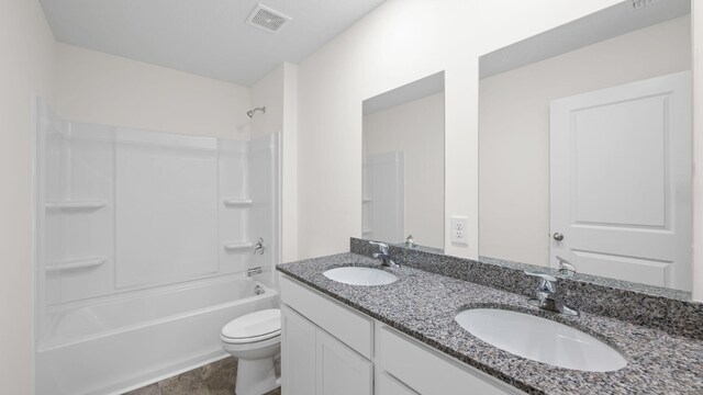 full bathroom with bathtub / shower combination, tile patterned flooring, vanity, and toilet