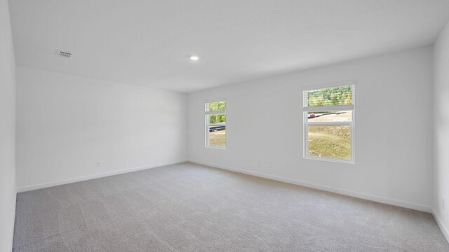 empty room featuring carpet floors