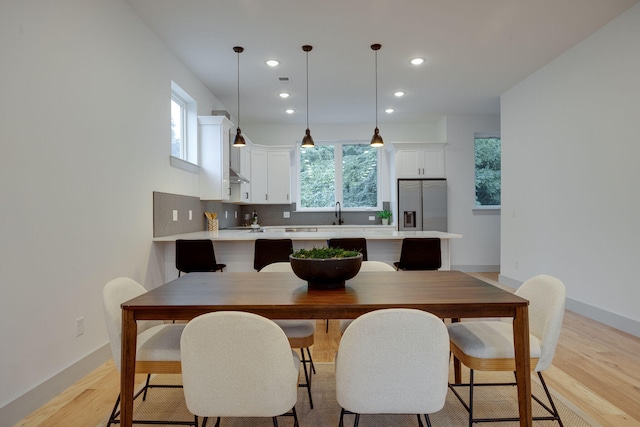 dining room with light hardwood / wood-style floors