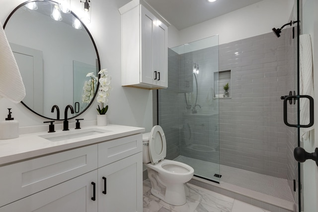 bathroom with vanity, toilet, and walk in shower