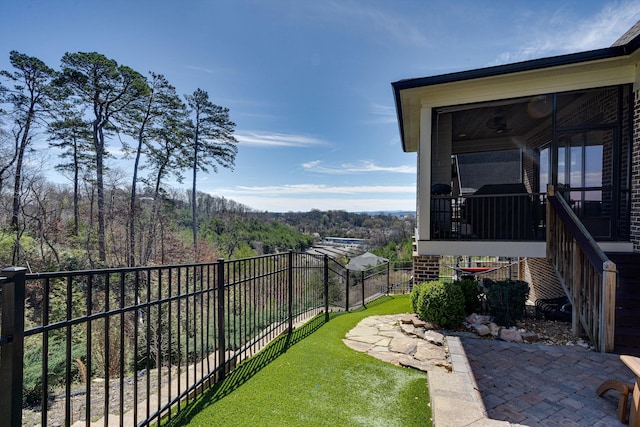 view of yard featuring a sunroom