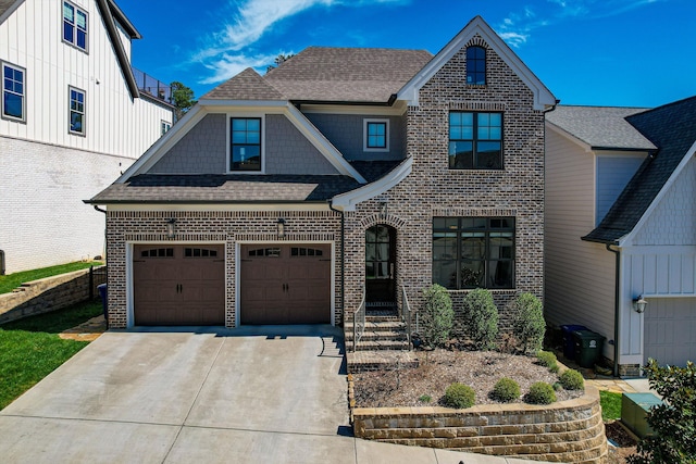 view of front of property featuring concrete driveway, roof with shingles, and brick siding