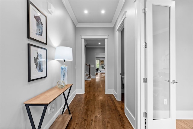 hall with crown molding and dark wood-type flooring