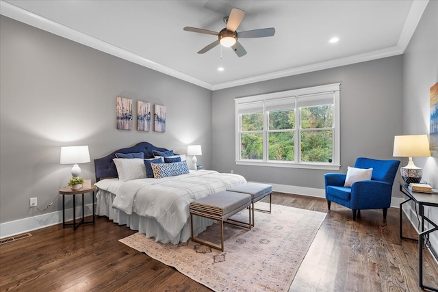 bedroom featuring ceiling fan, crown molding, and dark wood-type flooring