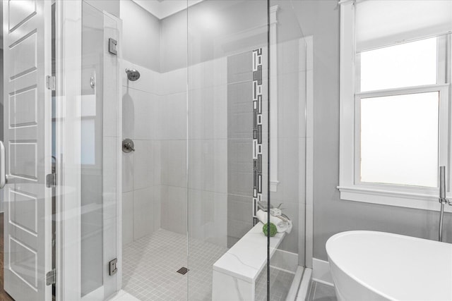 bathroom with separate shower and tub