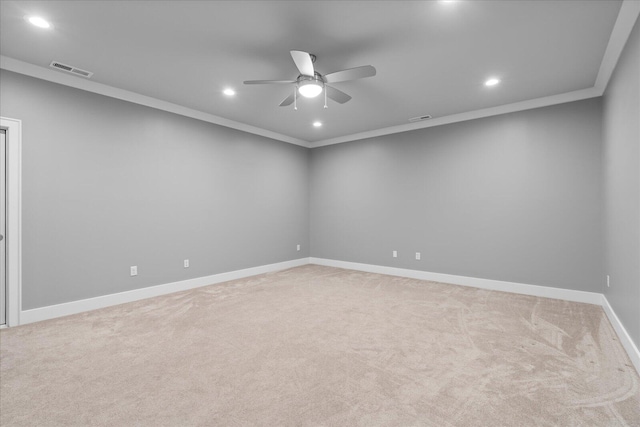 carpeted empty room with crown molding and ceiling fan