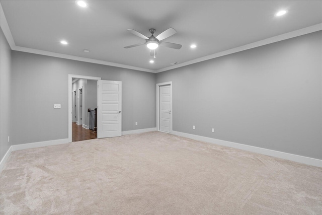 unfurnished bedroom with carpet, ceiling fan, and crown molding