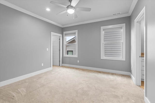 unfurnished bedroom with ceiling fan, light carpet, and ornamental molding